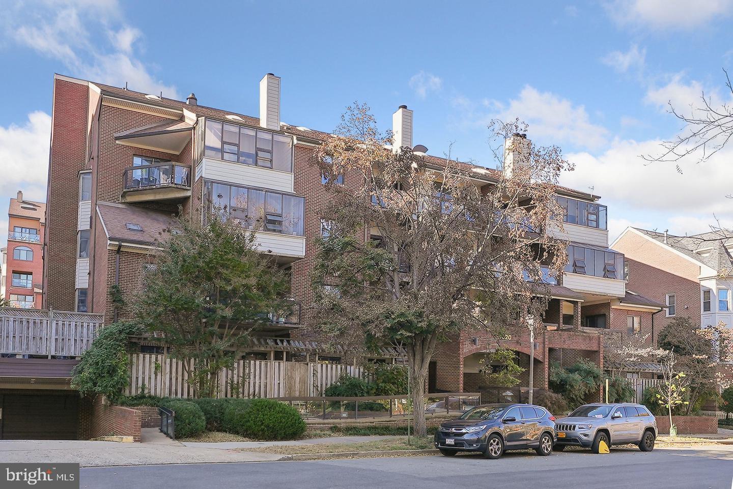 1020 North Stafford Street, Unit 311 Arlington, VA 22203 - Photo 3 of 37 a view of a parked cars in front of a building
