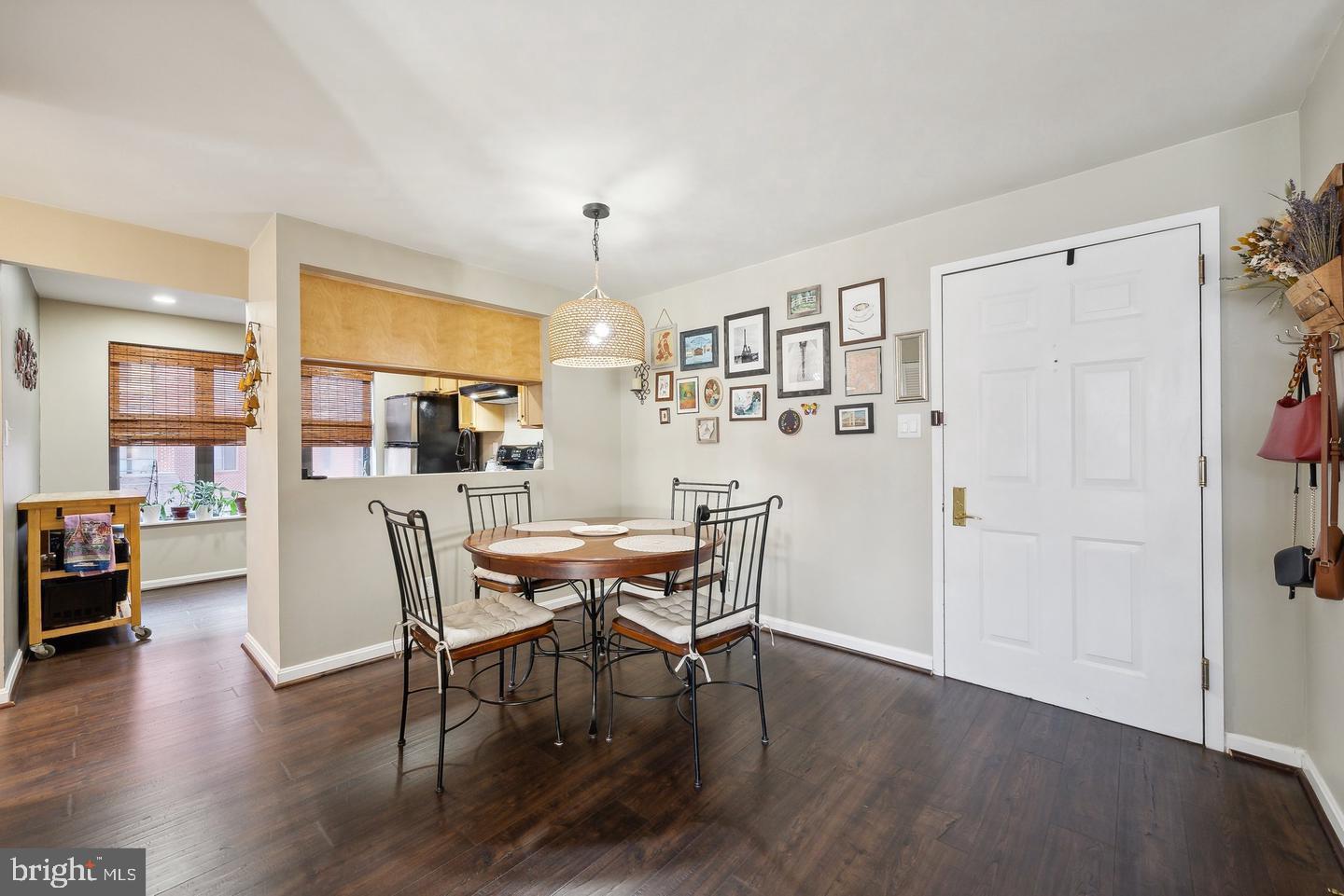 1020 North Stafford Street, Unit 311 Arlington, VA 22203 - Photo 5 of 37 a view of a dining room with furniture and wooden floor