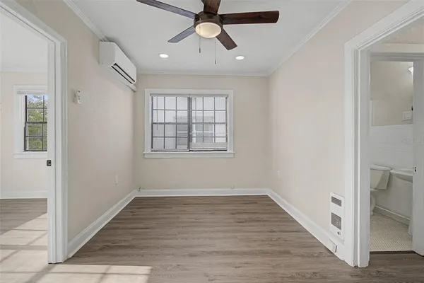 wooden floor in an empty room with a window
