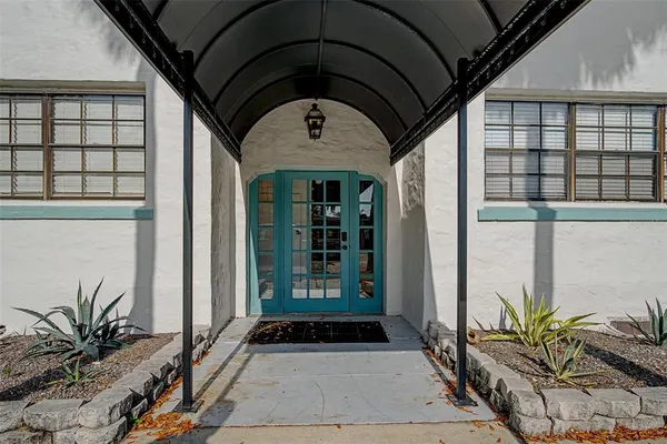 a front view of a house with a glass door