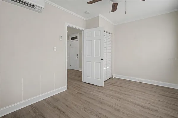 an empty room with wooden floor