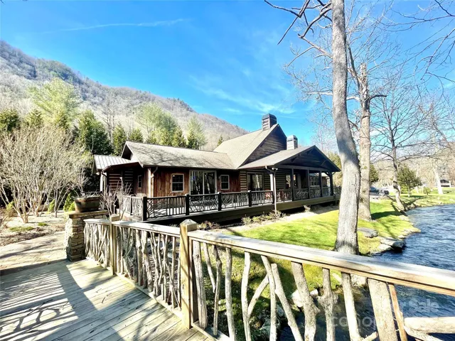 a front view of house with yard covered in snow