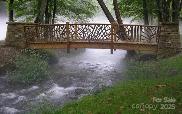 a view of a street with large trees