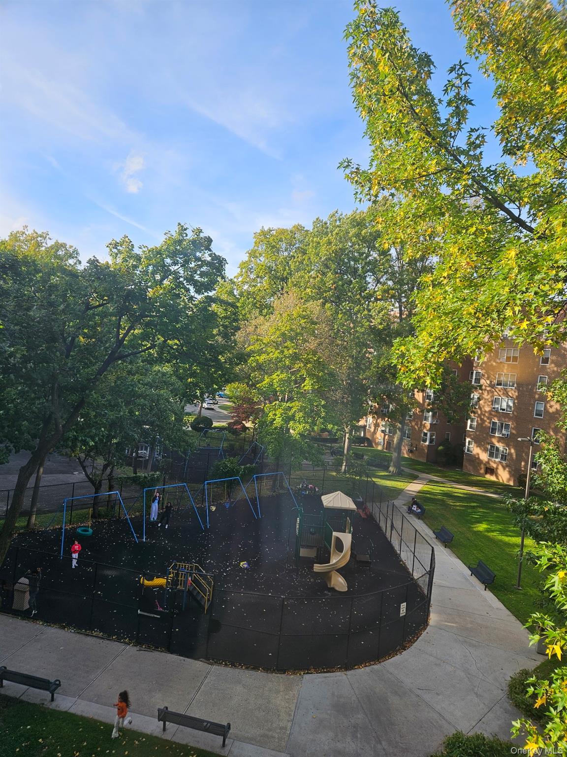 18-50 211th Street, Unit 3D Queens, NY 11360 - Photo 2 of 9 an outdoor view of garden with patio
