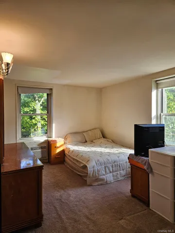 a room with a bed and a window