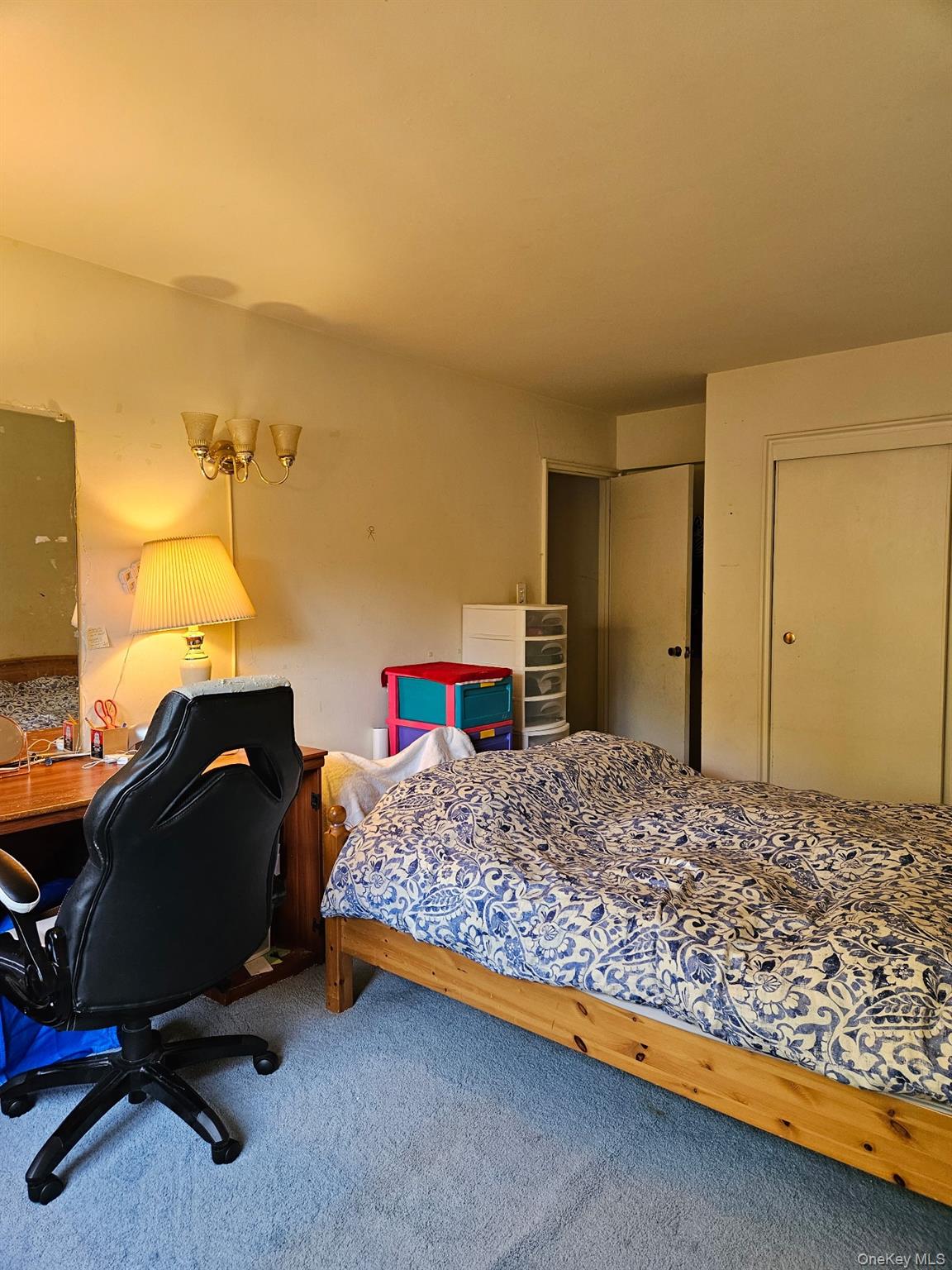 18-50 211th Street, Unit 3D Queens, NY 11360 - Photo 7 of 9 a bedroom with a bed and gym equipment