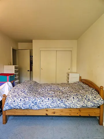 a bedroom with a bed and a view of bathroom
