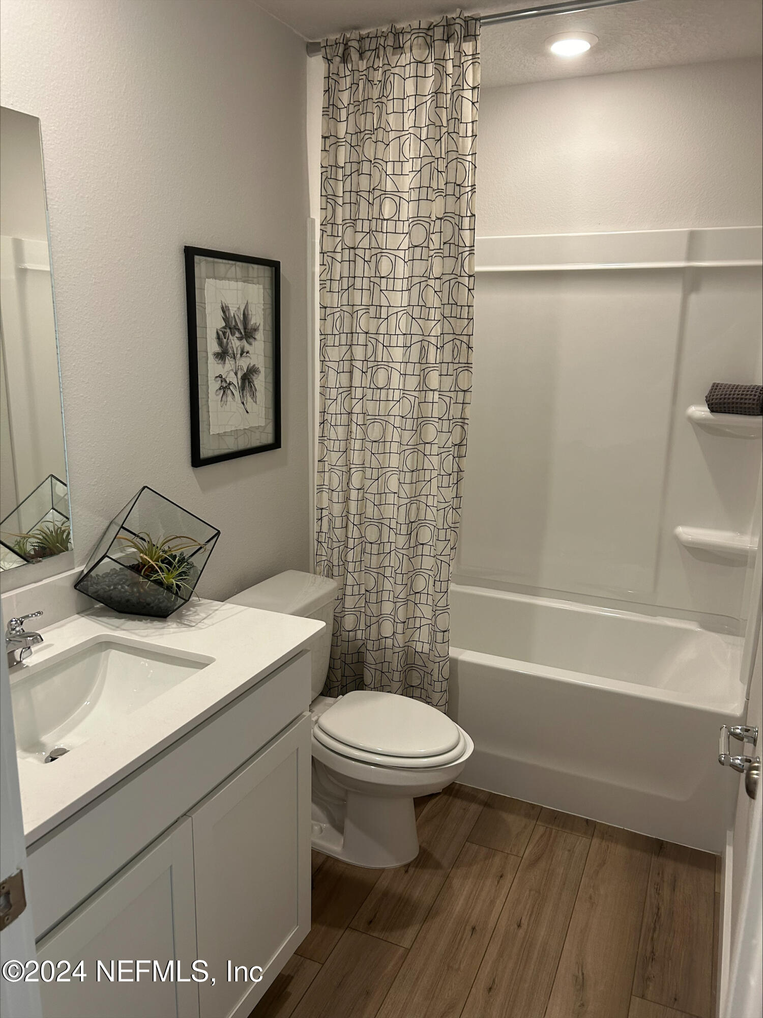 10694 Waterfield Road, Unit 19 Jacksonville, FL 32210 - Photo 9 of 12 a bathroom with a sink a toilet and a bathtub
