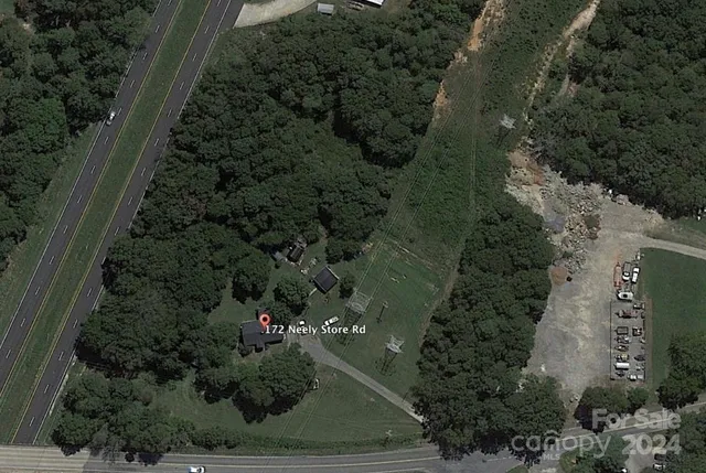 an aerial view of residential house with outdoor space