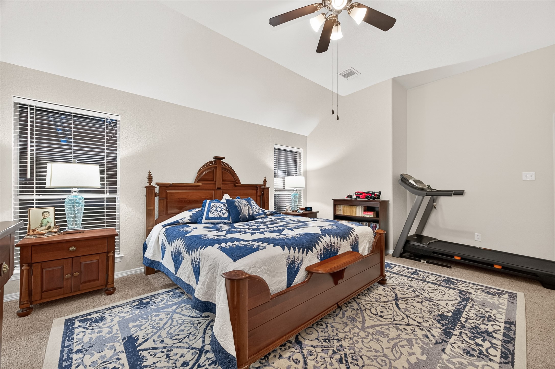 12455 West Summerlin Conroe, TX 77302 - Photo 19 of 31 a bedroom with a bed and wooden floor