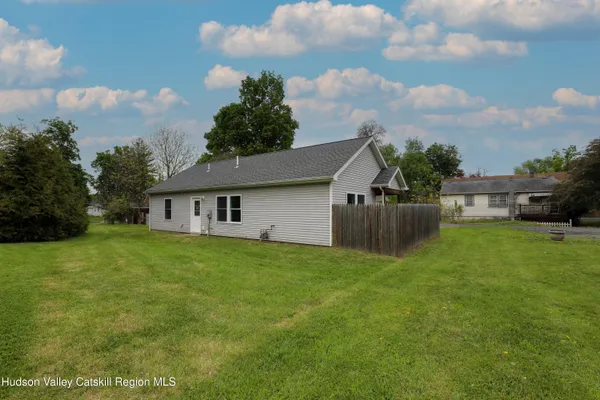 a view of a house with backyard