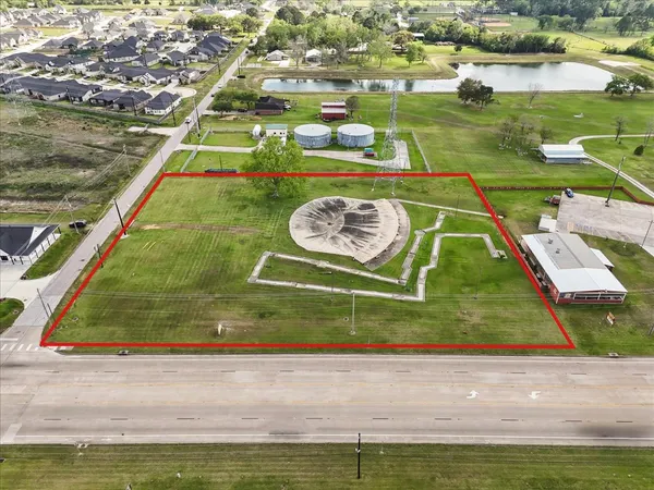 a view of a swimming pool with a yard