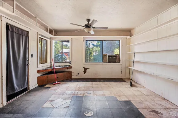 a living room with furniture and windows