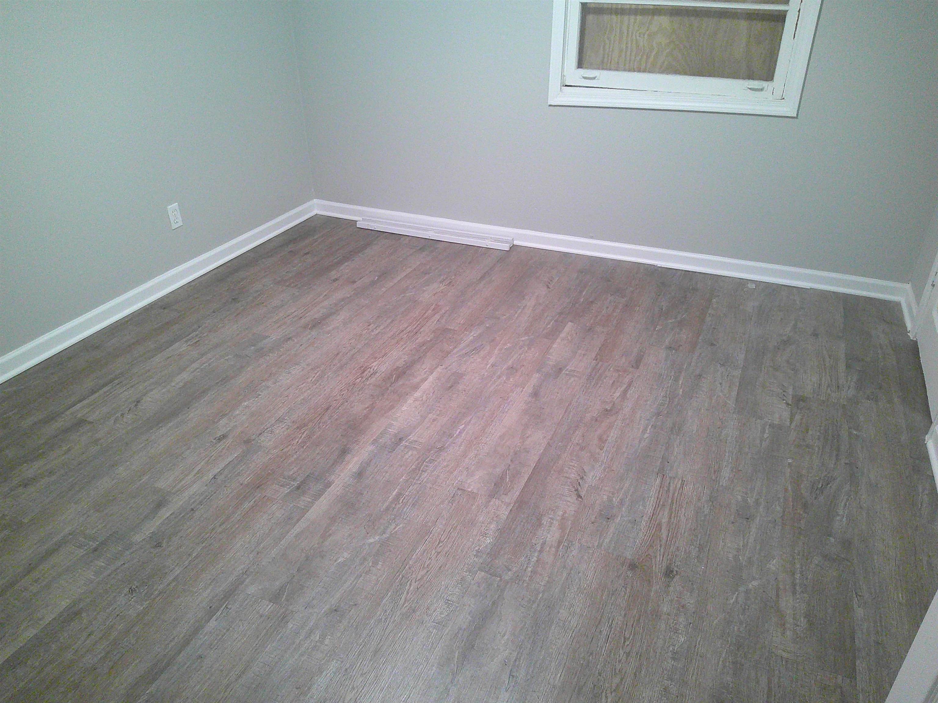 560 Jenson Road Memphis, TN 38109 - Photo 10 of 17 a view of a room that has wooden floor and large window