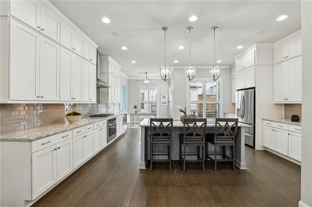 355 Cricket Lane Alpharetta, GA 30009 - Photo 12 of 39 a large kitchen with cabinets table and chairs