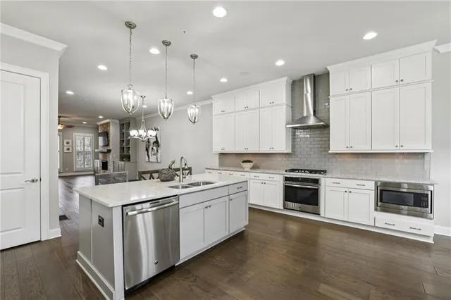 a kitchen with a sink stove and cabinets