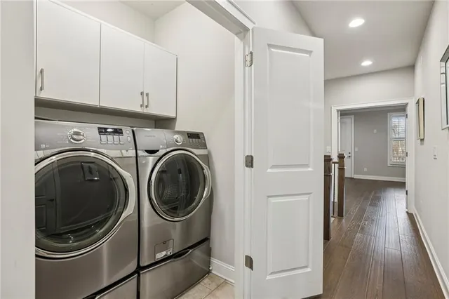 a view of a hallway with washer and dryer
