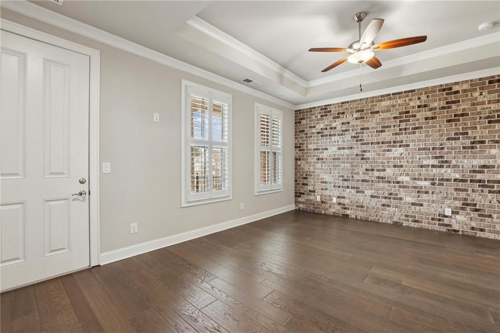 355 Cricket Lane Alpharetta, GA 30009 - Photo 18 of 39 wooden floor in an empty room with a window