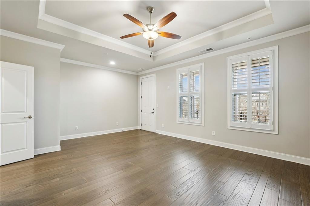 355 Cricket Lane Alpharetta, GA 30009 - Photo 21 of 39 an empty room with wooden floor and windows