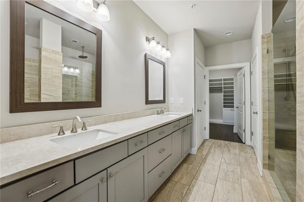 355 Cricket Lane Alpharetta, GA 30009 - Photo 22 of 39 a spacious bathroom with a double vanity sink and mirror
