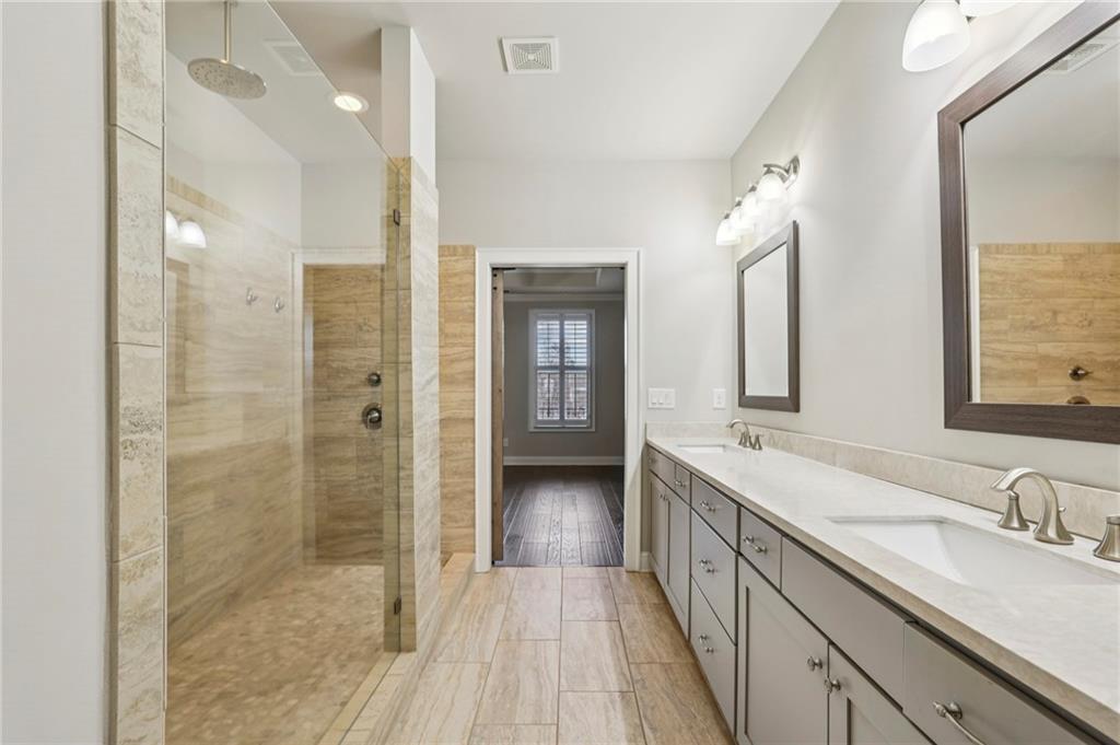 355 Cricket Lane Alpharetta, GA 30009 - Photo 25 of 39 a bathroom with a double vanity sink and mirror
