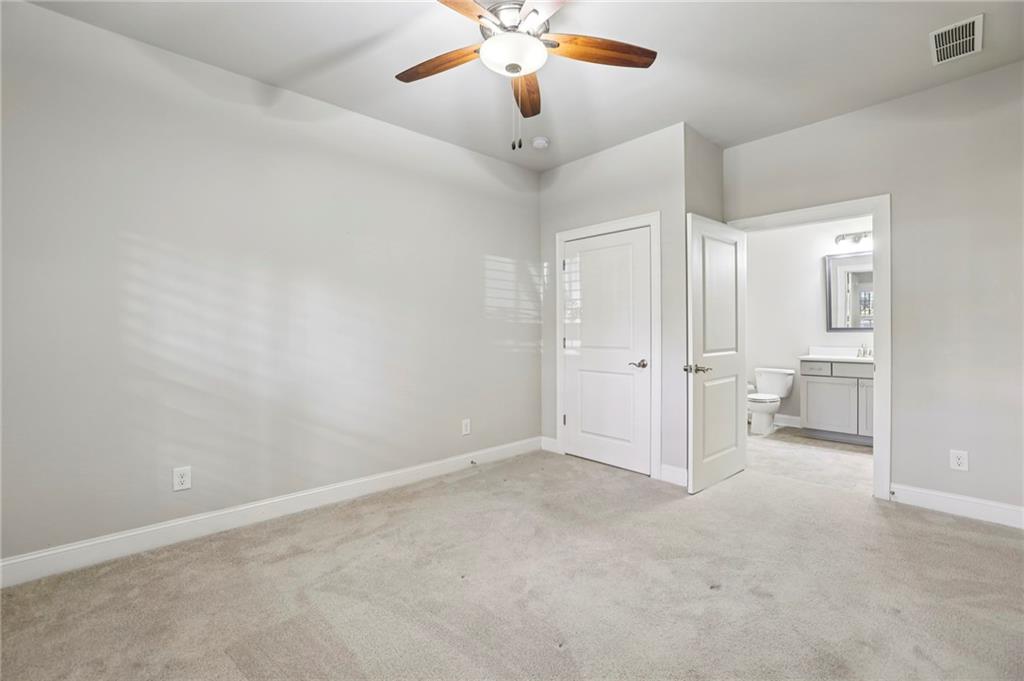 355 Cricket Lane Alpharetta, GA 30009 - Photo 37 of 39 an empty room with fan and entrance