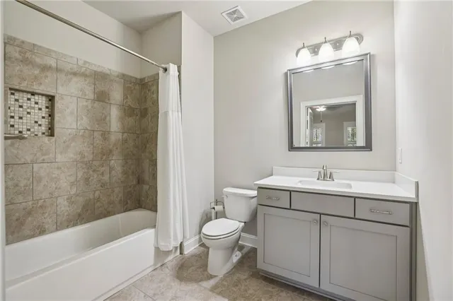 a bathroom with a toilet a sink and a bathtub