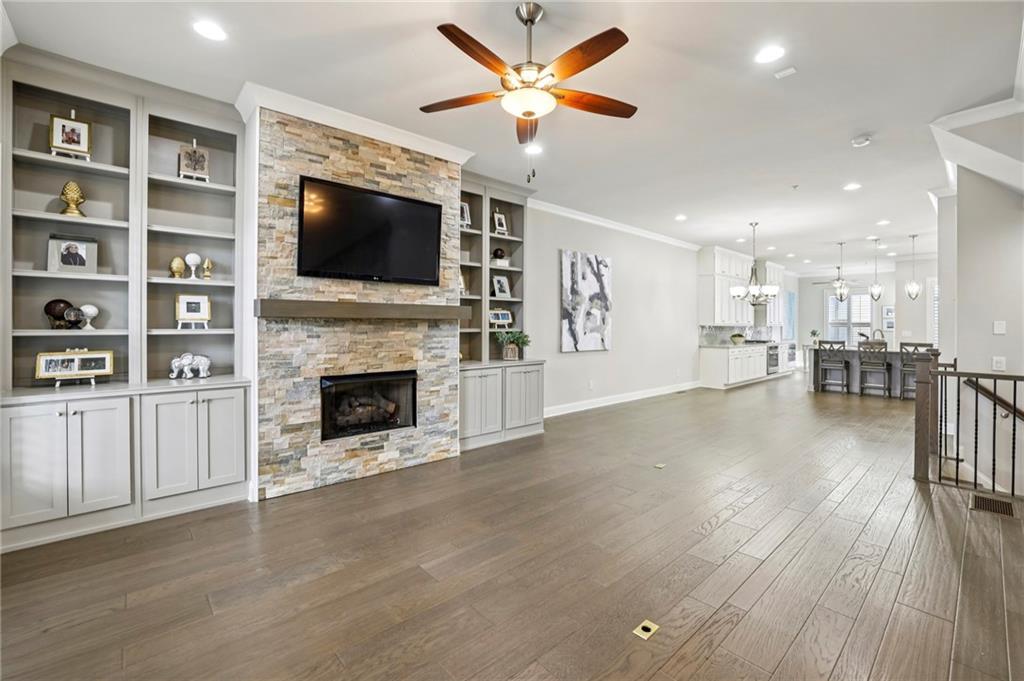 355 Cricket Lane Alpharetta, GA 30009 - Photo 5 of 39 a living room with furniture fireplace and flat screen tv