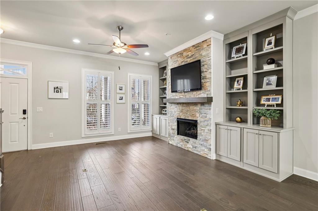 355 Cricket Lane Alpharetta, GA 30009 - Photo 6 of 39 a view of an empty room with a fireplace and a window