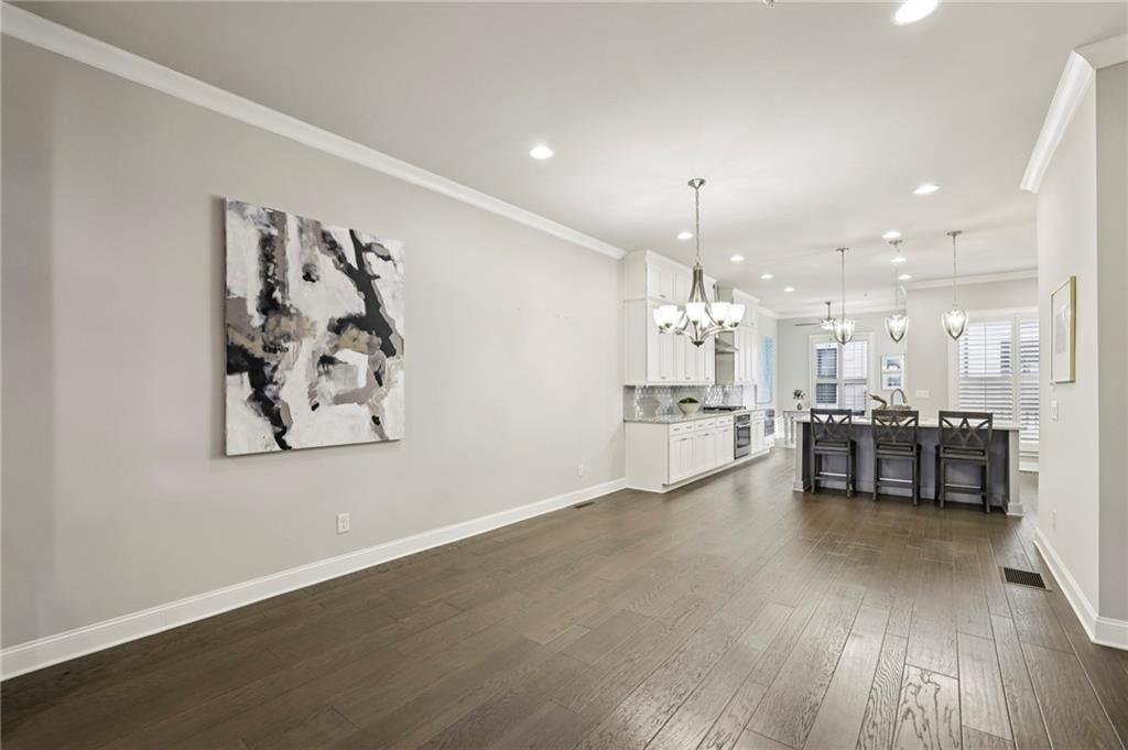 355 Cricket Lane Alpharetta, GA 30009 - Photo 7 of 39 a view of a kitchen with furniture and wooden floor