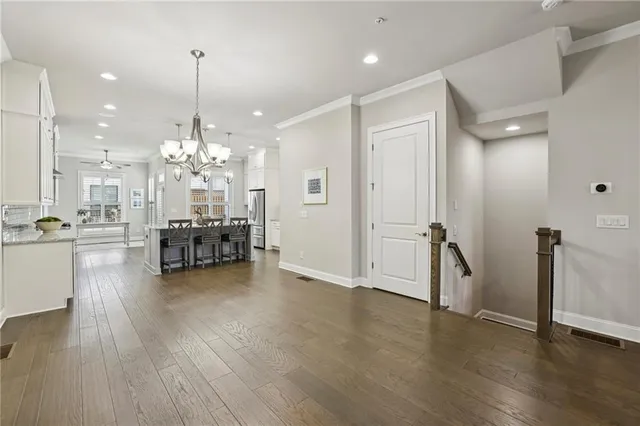 a view of a room with dining table a chandelier