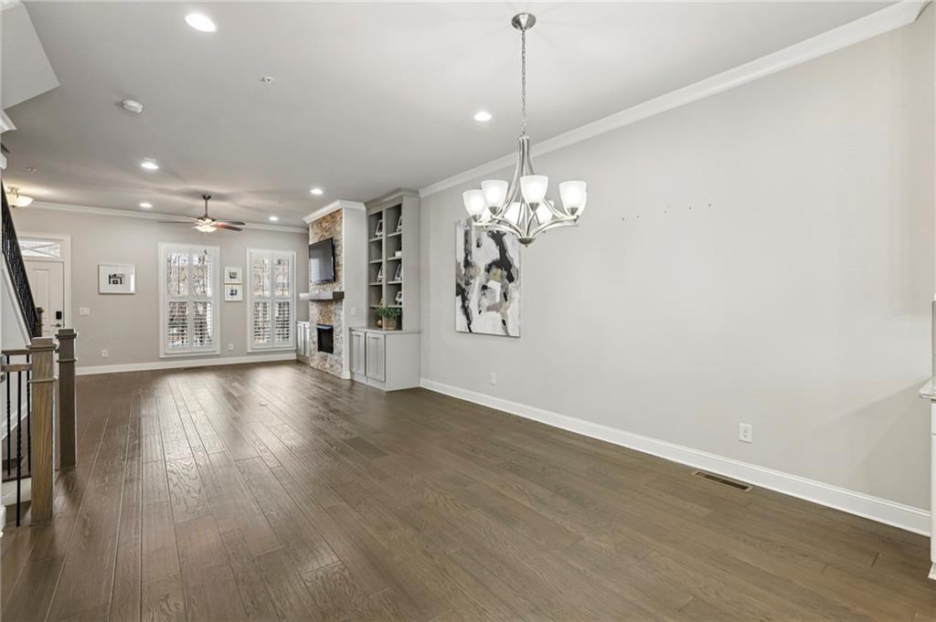 355 Cricket Lane Alpharetta, GA 30009 - Photo 9 of 39 a view of an empty room with wooden floor