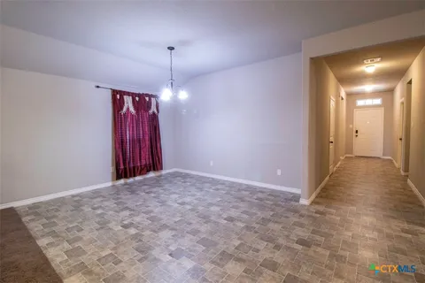 a view of a room with an entryway and stairs