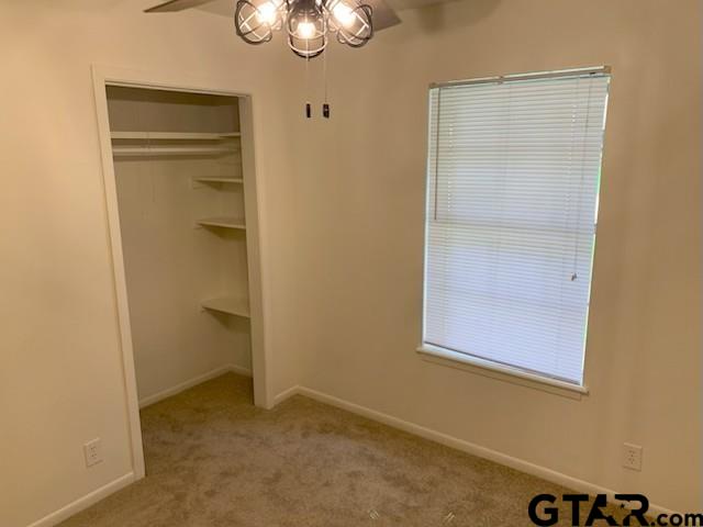 304 Lakeview Street Whitehouse, TX 75791 - Photo 14 of 17 an empty room with a door
