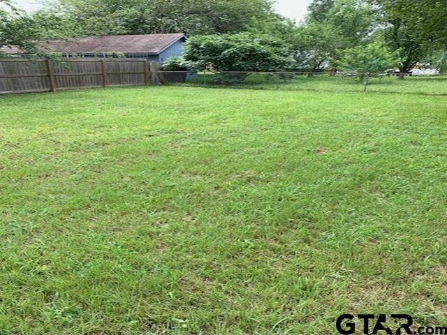 304 Lakeview Street Whitehouse, TX 75791 - Photo 17 of 17 a view of a backyard with a small house