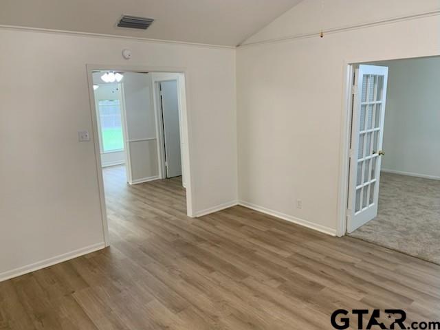 304 Lakeview Street Whitehouse, TX 75791 - Photo 7 of 17 an empty room with wooden floor and windows