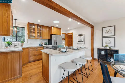 a kitchen with granite countertop lots of counter top space and stainless steel appliances