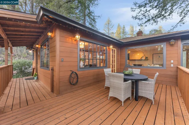 a view of living room with furniture and wooden floor