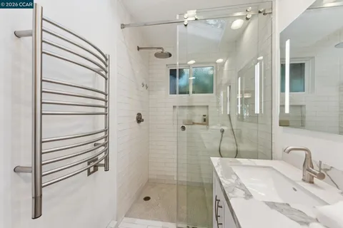 a bathroom with a sink and shower