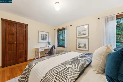 a bedroom with a large bed and a window