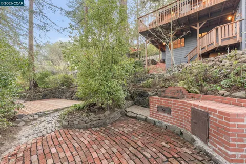 a view of a backyard with sitting area