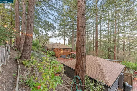 a view of a wooden deck and a trees