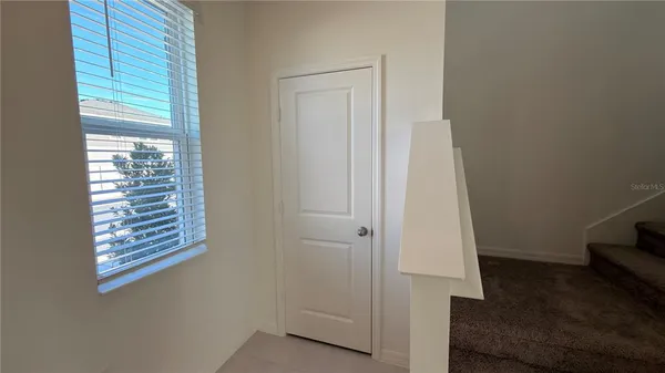 a view of hallway with windows