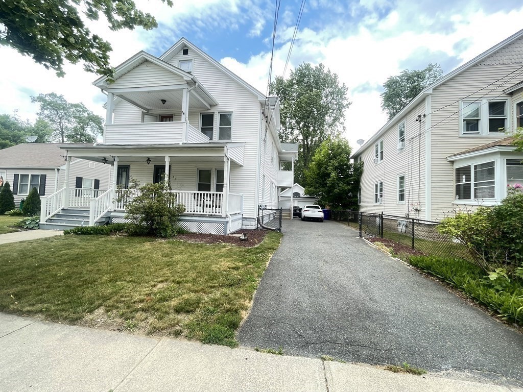 85-87 Windemere Street Springfield, MA 01104 - Photo 3 of 25 a front view of a house with a yard