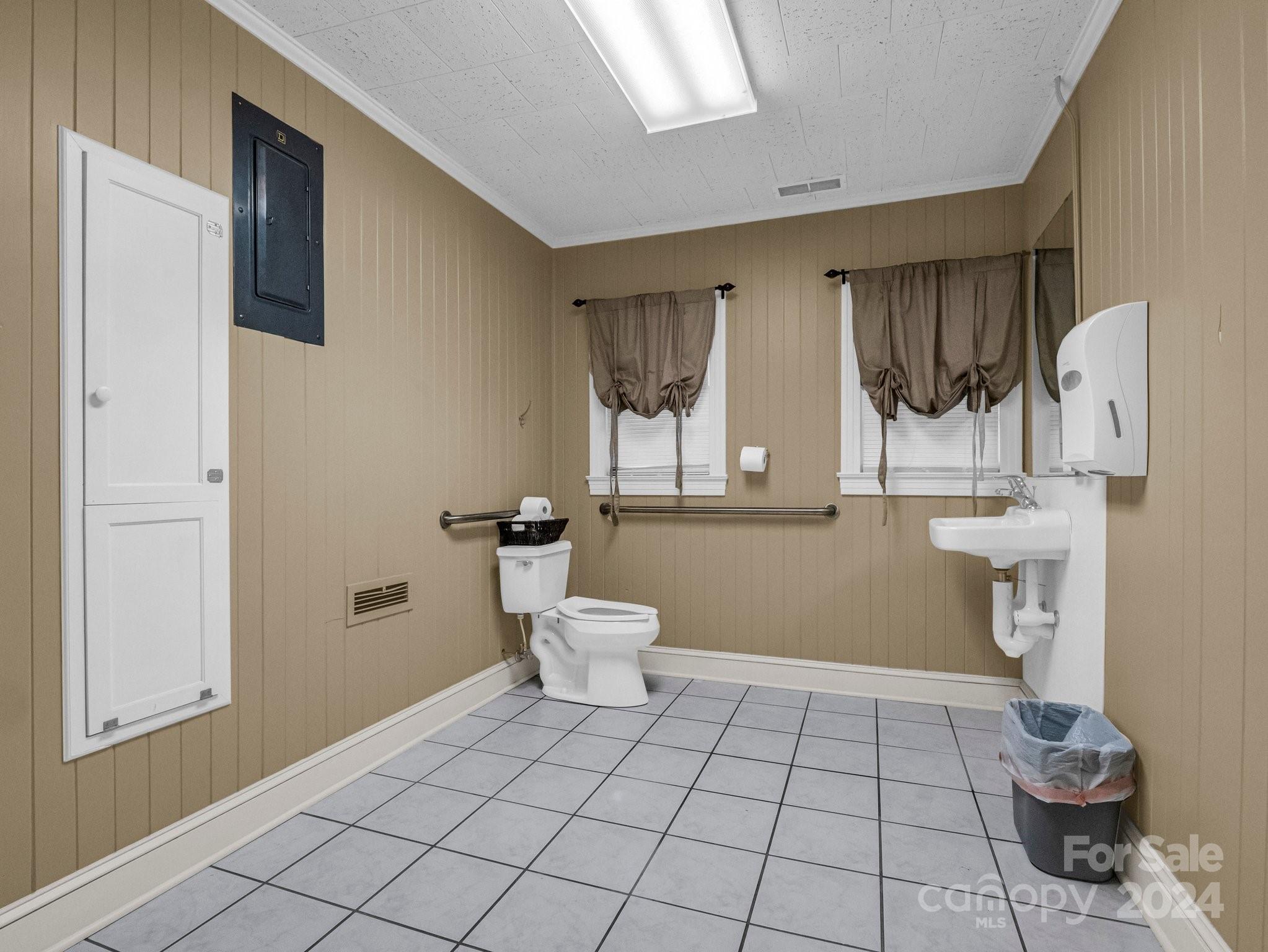349 North Main Street Rutherfordton, NC 28139 - Photo 19 of 27 a bathroom with a toilet a sink and mirror
