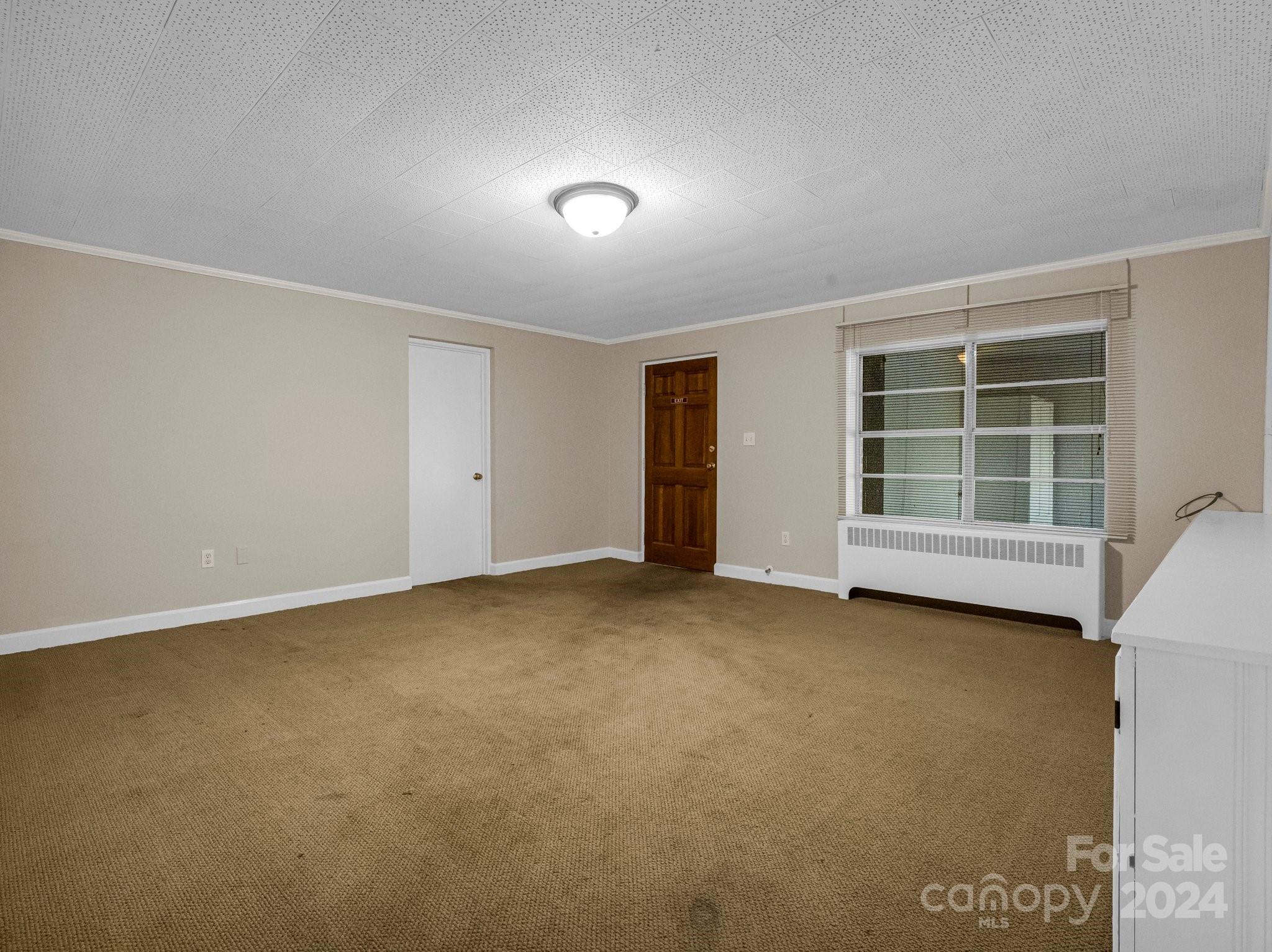 349 North Main Street Rutherfordton, NC 28139 - Photo 24 of 27 an empty room with a window