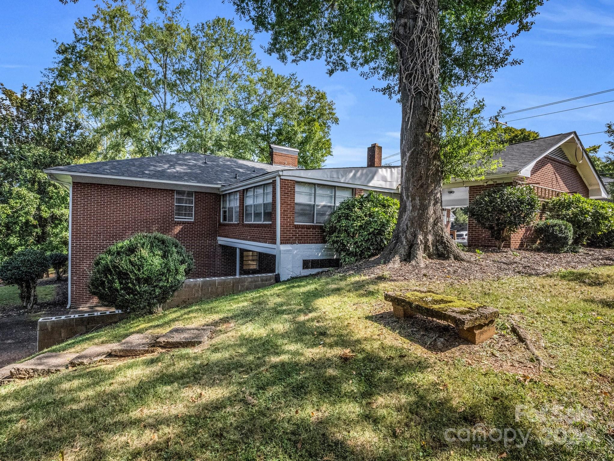 349 North Main Street Rutherfordton, NC 28139 - Photo 5 of 27 a view of a house with backyard and sitting area