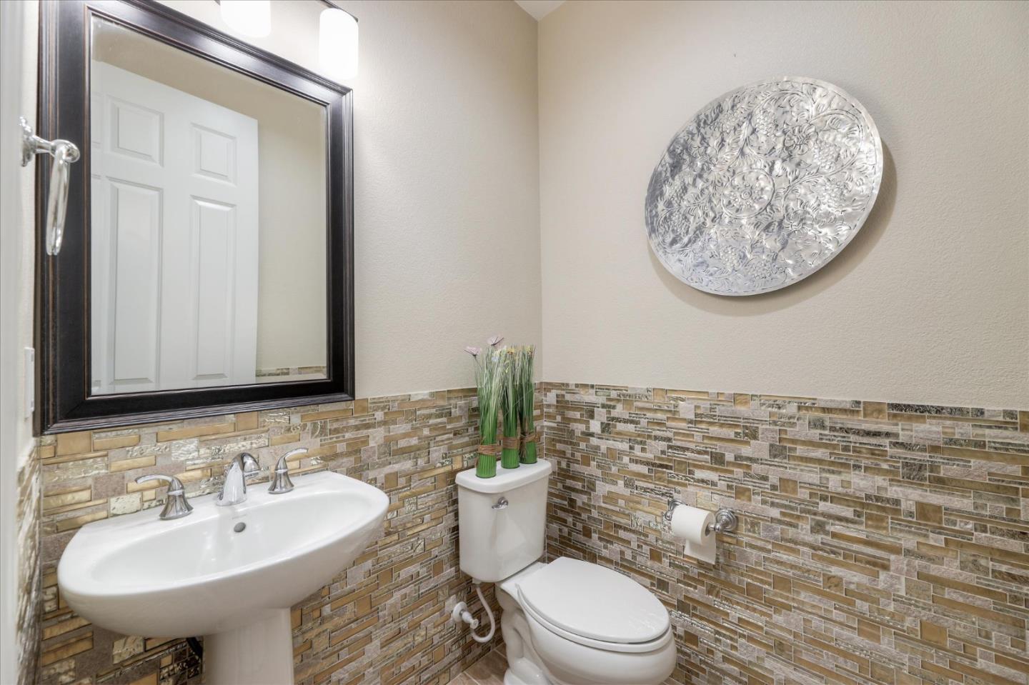 1000 South Monarch Road San Ramon, CA 94582 - Photo 18 of 23 a bathroom with a toilet a sink and a mirror