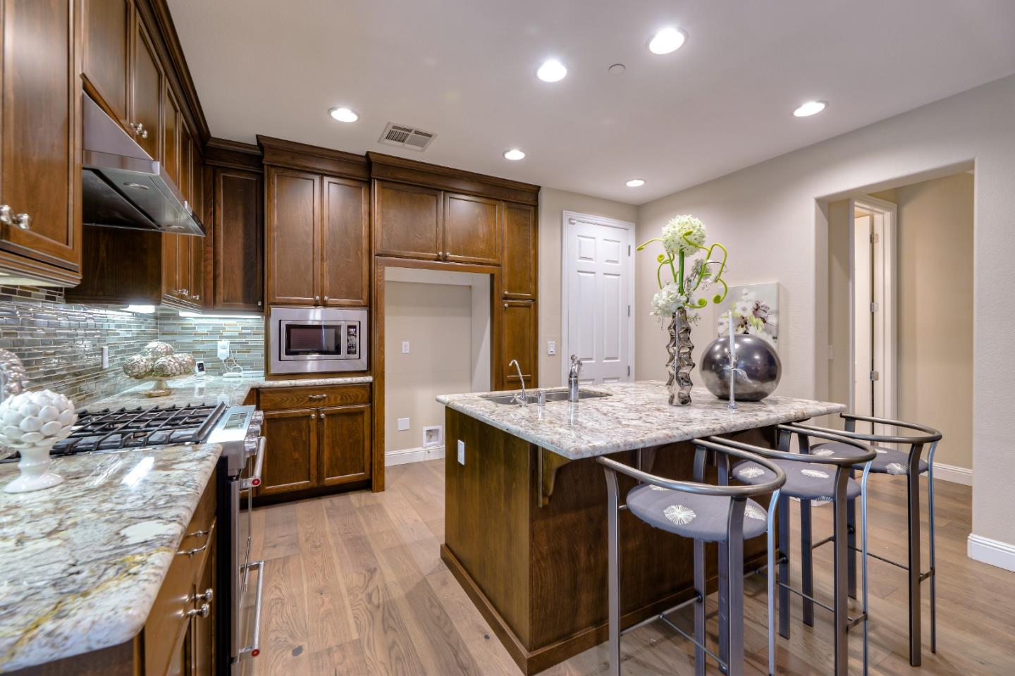 1000 South Monarch Road San Ramon, CA 94582 - Photo 8 of 23 a kitchen with kitchen island granite countertop a sink appliances and cabinets