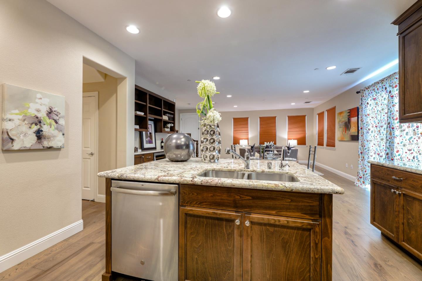 1000 South Monarch Road San Ramon, CA 94582 - Photo 9 of 23 a kitchen with stainless steel appliances granite countertop a sink a stove and a wooden floors